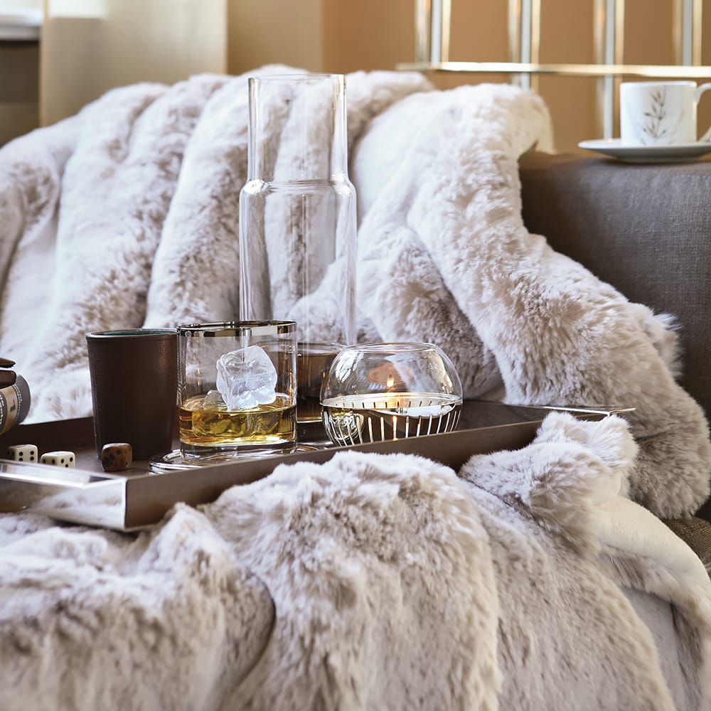 Impress the guests, snow leopard faux fur throw