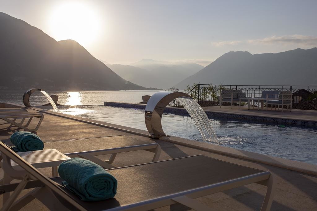 Allure Palazzi Hotel rooftop pool with view of Bay of Kotor