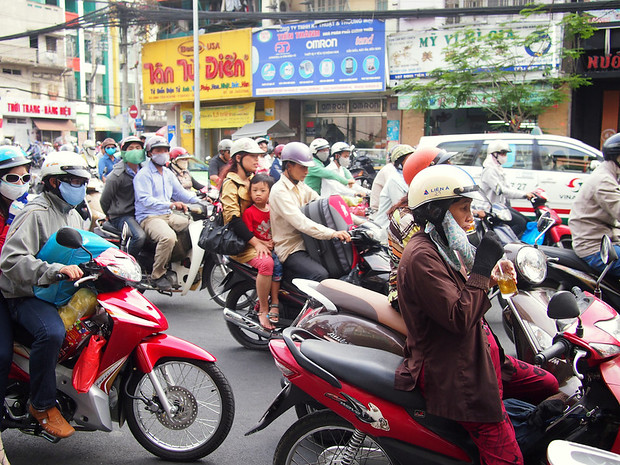 Vietnam, Saigon, Ho Chi Minh City, moto taxis in very busy traffic