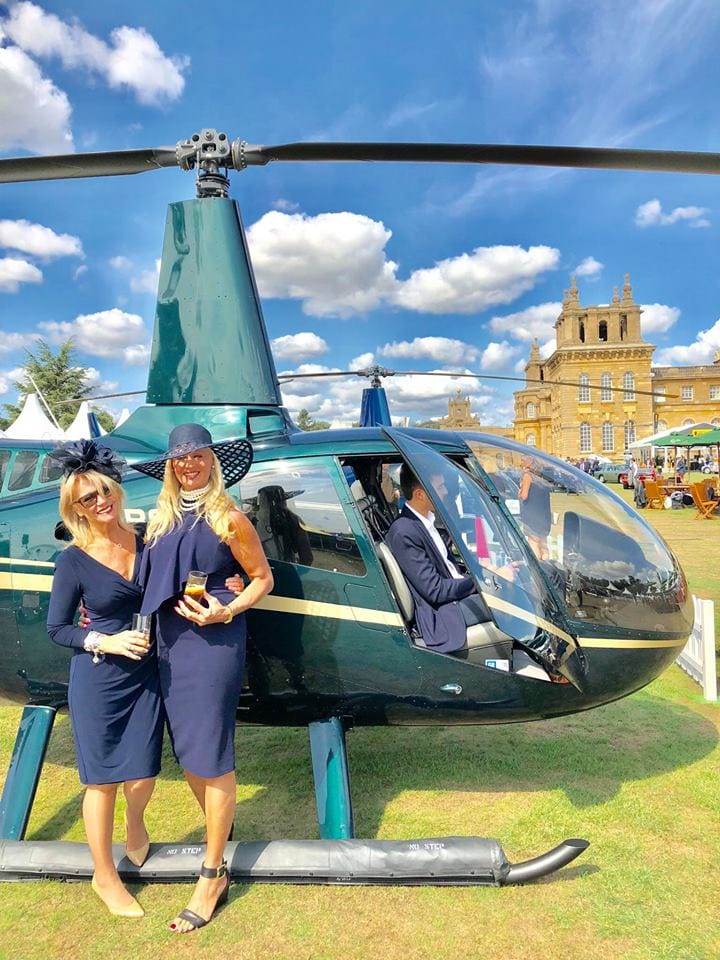 Salon Privé 2018, Juliette and Fiona next to a helicopter on the lawns at Blenheim Palace