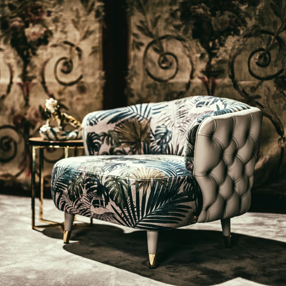 Impress the guests, tub chair with cream leather, deep buttoned back and bold floral fabric cushions