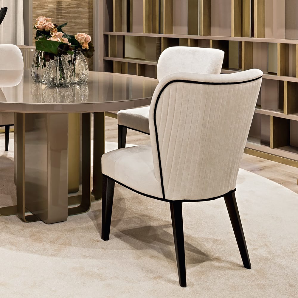 Impress the guests, textured velvet dining chair in cream with black piping and black legs