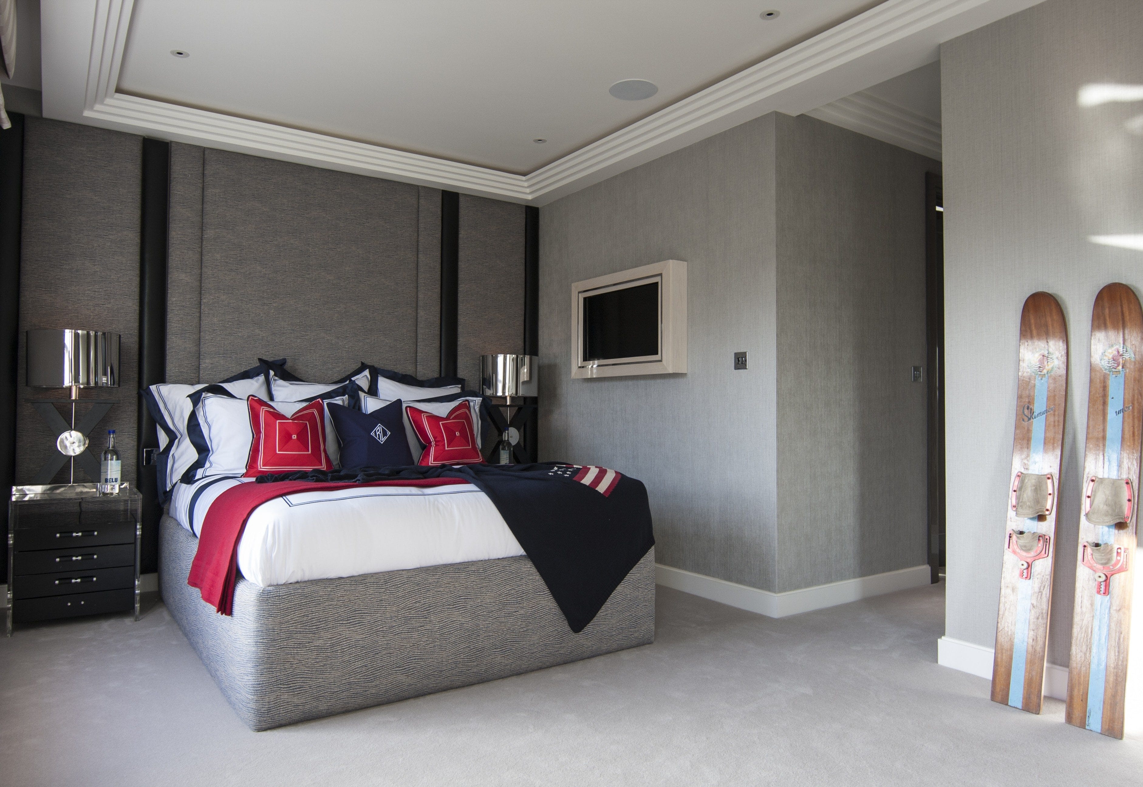 bespoke furniture bed wallcoverings soft grey red blue accents