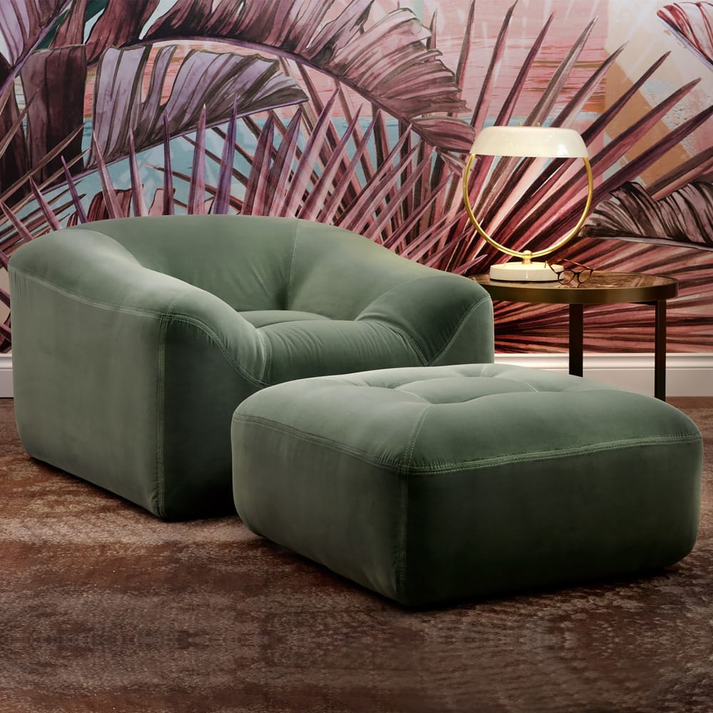 interior design trends 2020, forest green armchair and pouffe