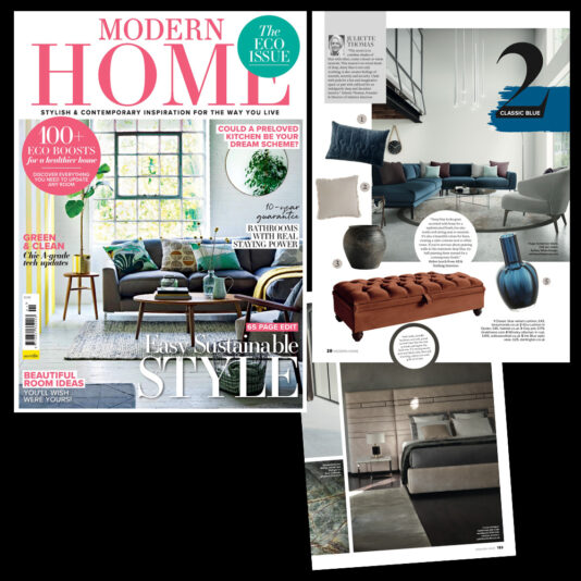 A cover of "Modern Home" magazine's eco issue with interior design features. The cover shows a stylish living room. To the right, a section highlights a blue-themed living room with a jade-green sofa, a brown bench, a blue vase, and various decor items.