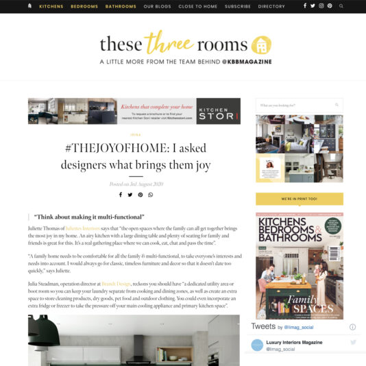 A webpage from "these three rooms" by KBBMAGAZINE features an article titled "#THEJOYOFHOME: I asked designers what brings them joy." The page includes sections about kitchen storage, a white kitchen interior photo, and social media handles.