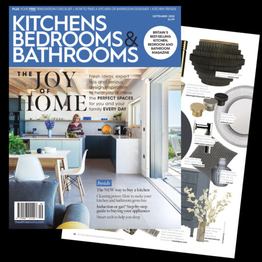 Cover of "Kitchens Bedrooms & Bathrooms" magazine, September 2023 issue. The main headline states "The Joy of Home." The cover features a modern kitchen design with a wooden island, bar stools, and large windows. An interior design article is highlighted alongside.