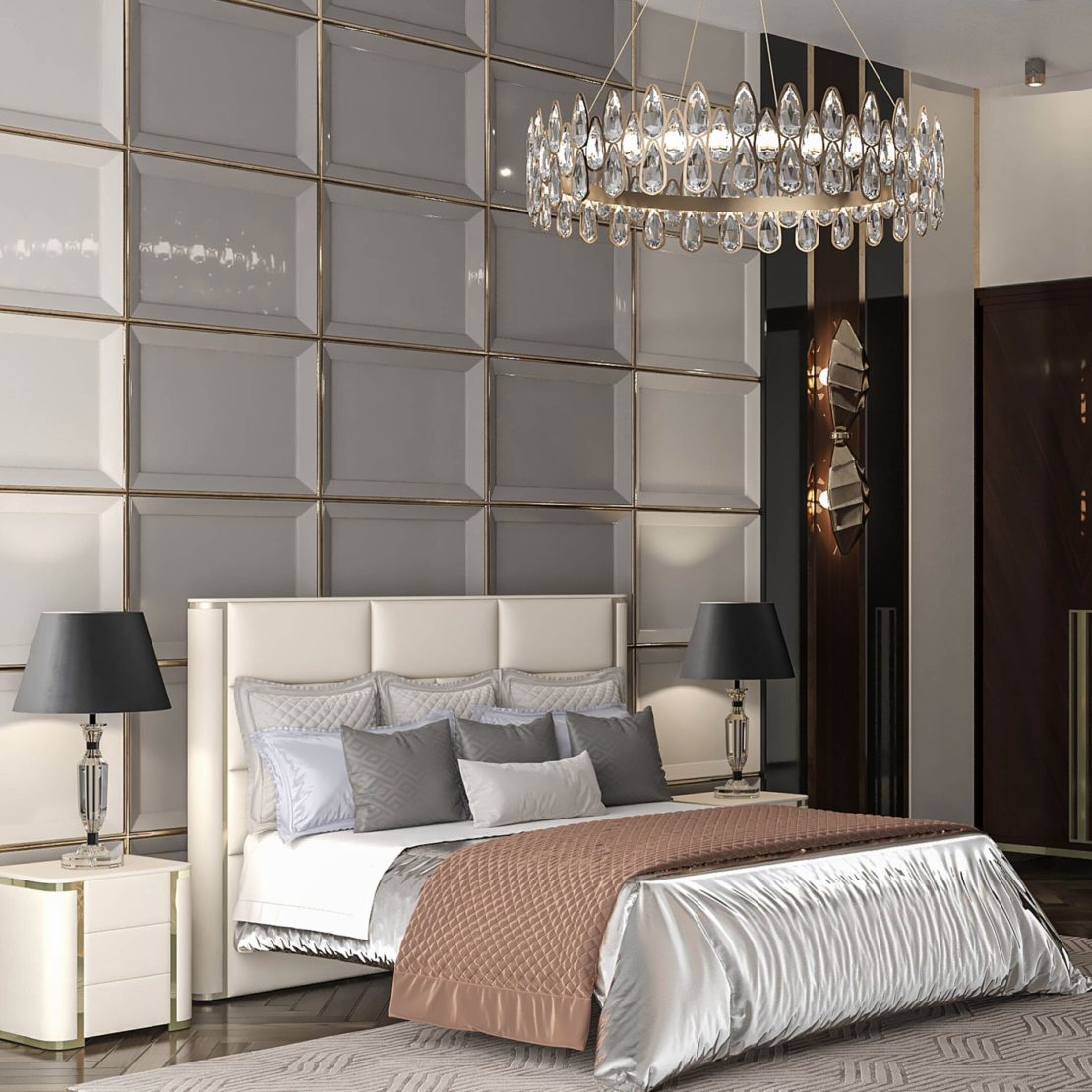 A modern luxury bedroom interior design featuring a luxurious bed with white and gray bedding, flanked by two white nightstands with black lamps. An elegant crystal chandelier hangs above, and a textured, reflective wall forms the backdrop, adding depth to the room's sophisticated decor.