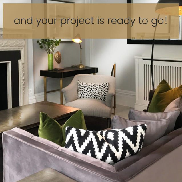 A modern living room with a gray couch adorned with green and black-and-white patterned pillows. A cozy armchair, an elegant black desk, and a floor lamp are also present. The text "and your project is ready to go!" is overlaid at the top, thanks to our online interior design course.