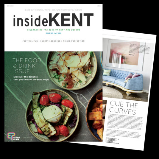 An issue of "insideKENT" magazine. The cover features dishes of food garnished with vegetables, and the headline reads "The Food & Drink Issue." An interior page, titled "Cue the Curves," showcases a stylishly furnished room with a curved couch and decorative accents.