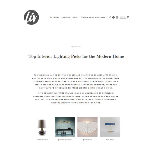 A web page from "liv" featuring an article titled "Top Interior Lighting Picks for the Modern Home." It includes images of four lighting products: Porta Romana, Juliette Interiors, Jondemoose, and Bert Frank. The article discusses trends in interior lighting.