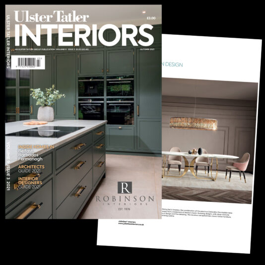 A magazine cover titled "Ulster Tatler Interiors" featuring a modern green kitchen with gold accents and a vase of white flowers on the counter. Overlaying is a page showing a dining room with a light fixture and minimalist furniture from Robinson Interiors, blending sophistication and style.