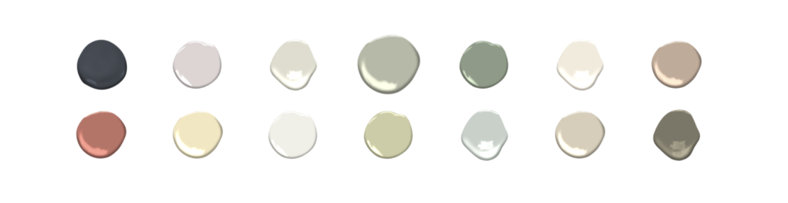 Fifteen paint drops arranged in three rows of five. Each drop is a different color, including shades of black, gray, green, beige, orange, and white, reflecting the colour trends 2022 against a plain white background.