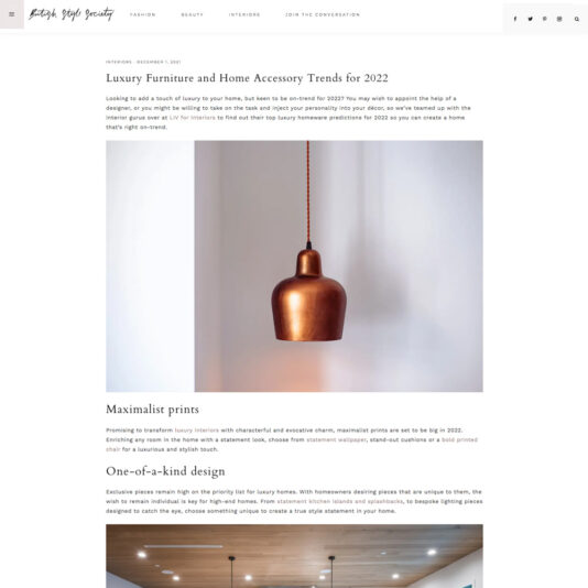 Screenshot of a webpage from a blog titled "Luxury Furniture and Home Accessory Trends for 2022." It features sections with texts and images. The main image shows a copper pendant light fixture. The article discusses trends such as maximalist prints and unique home designs.