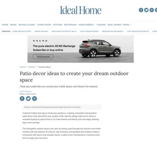 Screenshot of an Ideal Home article titled "Patio decor ideas to create your dream outdoor space." It features a photo of a Volvo XC40 electric car ad at the top and text discussing patio decor below, published by Alison Davidson on March 22, 2021.