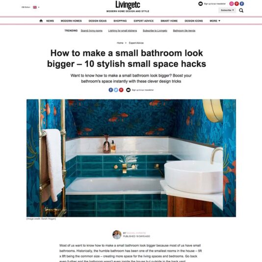 A webpage from Livingetc titled "How to make a small bathroom look bigger – 10 stylish small space hacks" showcases a well-decorated bathroom with vibrant blue and green wallpaper, a white sink, a mirror, golden towel hanger, and various toiletries.