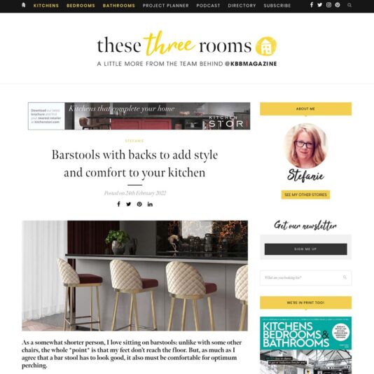 A webpage titled "Barstools with backs to add style and comfort to your kitchen," featuring a kitchen island with barstools and an inset of a woman named Stefanie. The page includes various navigation options, guides on how these three rooms can complement each other, and a sidebar with sections for newsletters and magazines.