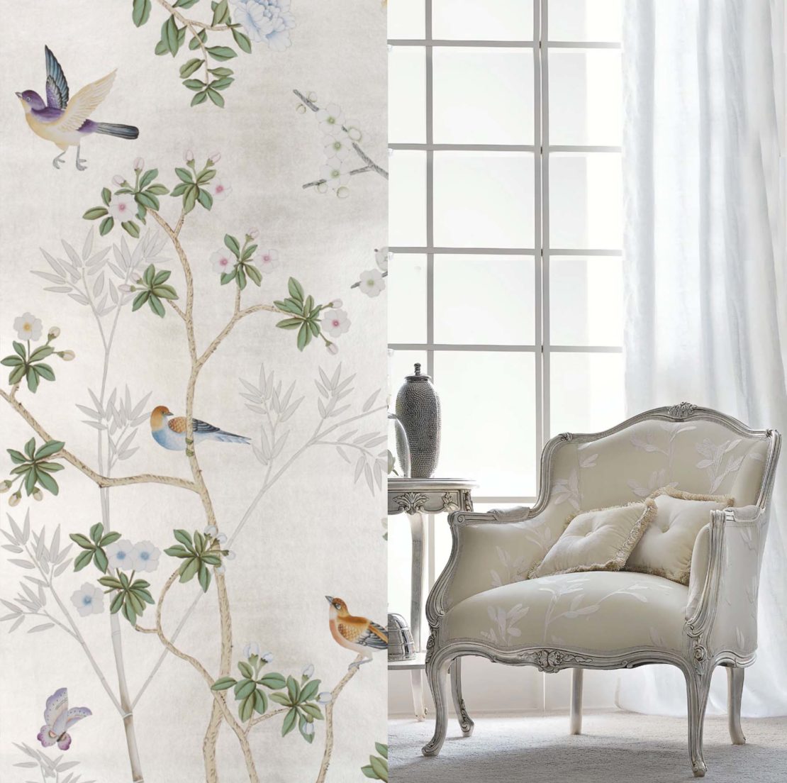 An ornate, Bridgerton-inspired armchair with floral upholstery sits in a brightly lit room beside a small side table, two decorative items, and a window with sheer white curtains. The wall features nature-themed wallpaper with birds and flowering branches on the left side.