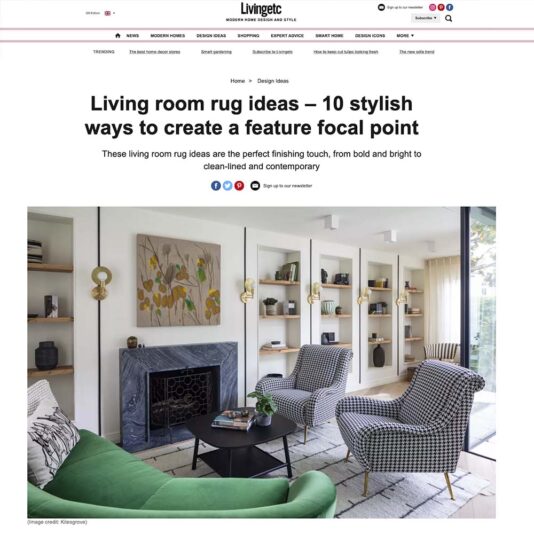 Screenshot of a Livingetc article titled "Living room rug ideas — 10 stylish ways to create a feature focal point." The featured image showcases a modern living room with a fireplace, two checked armchairs, a green sofa, and a geometric patterned rug.