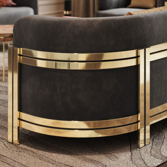 Modern Curved Sofa With Brass Frame A close-up of the Modern Curved Sofa With Brass Frame, featuring dark, plush fabric upholstery and shiny, golden metal legs. The metallic gold accents add a touch of sophistication to the design. The background shows a textured carpet.