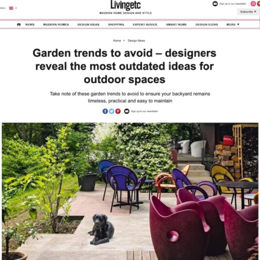 A magazine article screenshot titled "Garden trends to avoid – designers reveal the most outdated ideas for outdoor spaces." The image shows a garden with colorful chairs, plants, and a black dog lying on the ground. The garden has a mix of modern and mismatched furniture.