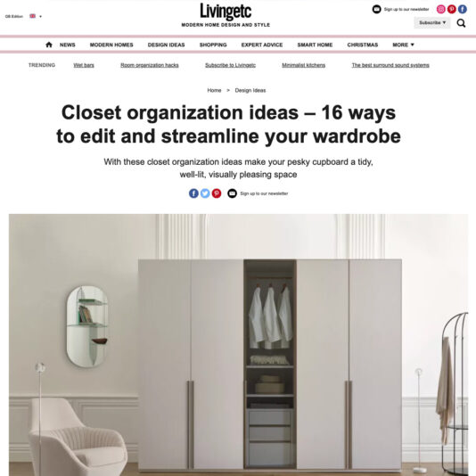 Screenshot of a Livingetc website article titled "Closet organization ideas – 16 ways to edit and streamline your wardrobe." The image features a minimalist, modern wardrobe with sliding white doors, an armchair, and a round mirror with shelves that offer smart closet organization ideas.