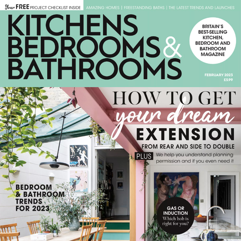 Cover of Kitchens Bedrooms & Bathrooms magazine, February 2023 issue. It features an article titled "How to Get Your Dream Extension" with a focus on bedroom and bathroom trends for 2023. The background shows a cozy kitchen and dining area complete with designer barstools, plants, and decor.