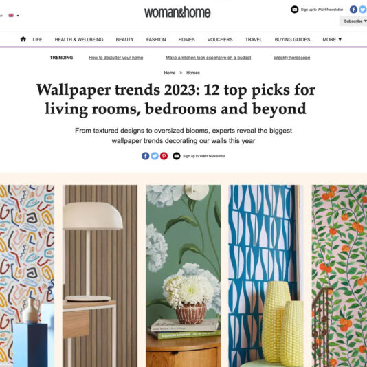 A screenshot of a webpage from woman&home features an article titled "Wallpaper trends 2023: 12 top picks for living rooms, bedrooms, and beyond." Below the title, five wallpaper designs are displayed in vertical columns, showcasing various patterns and colors.