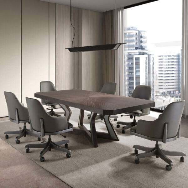A modern conference room featuring the Luxury Veneered Boardroom Table, accompanied by six gray swivel chairs and illuminated by a sleek black linear pendant light overhead. Large windows in the background provide a view of high-rise buildings. The room boasts beige walls and a partially carpeted floor.