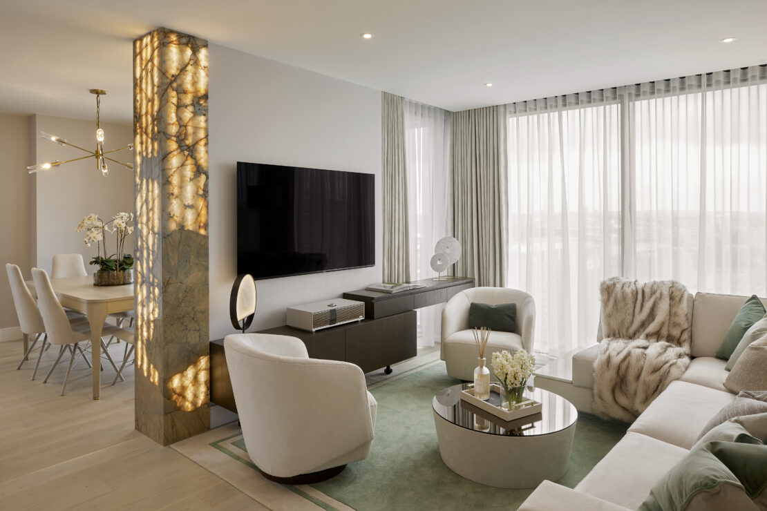 Luxury living room leading to dining room in apartment Battersea London designed by Juliettes Interiors