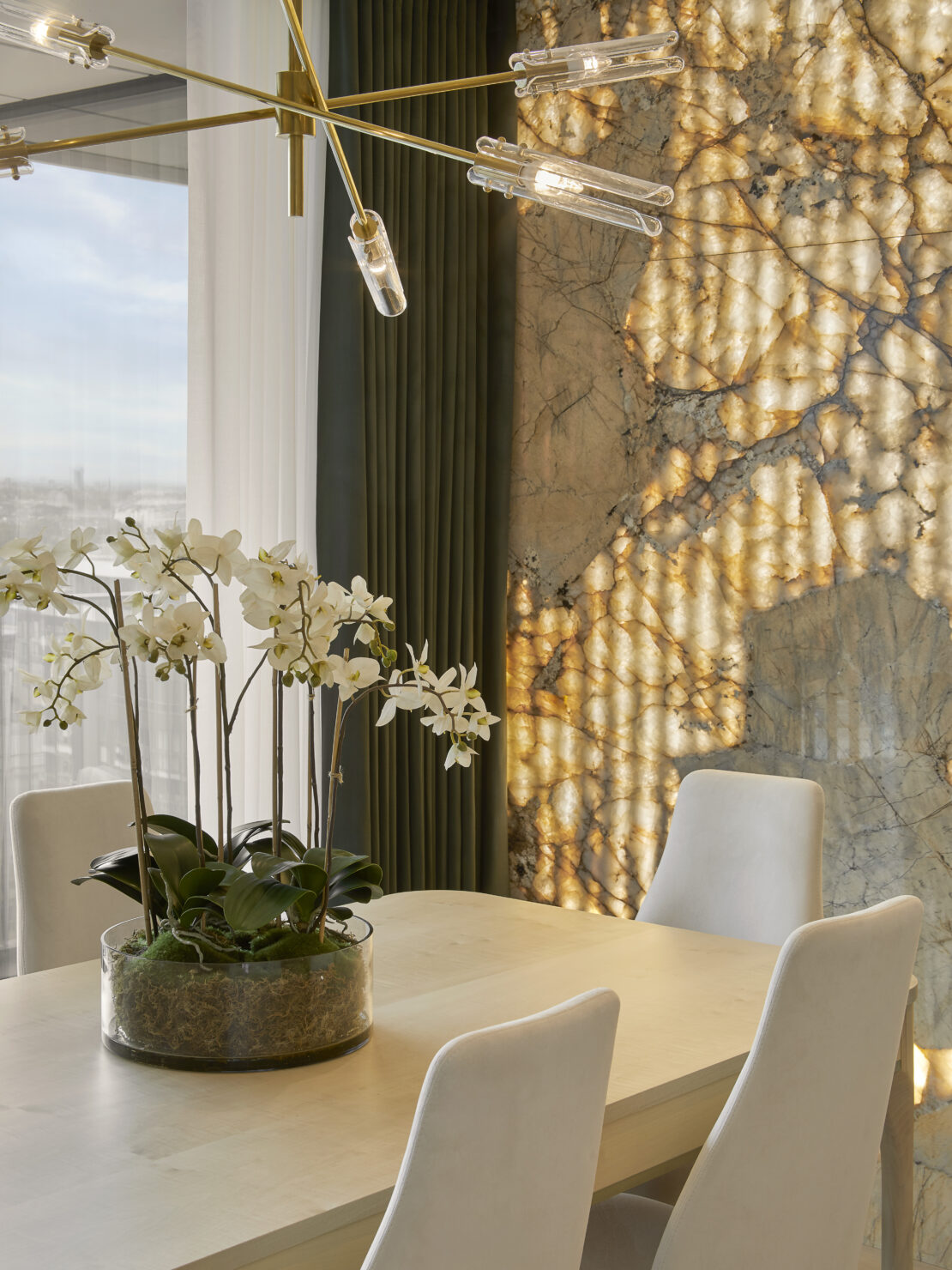 Patagonian stone wall backlit up with LEDs in bespoke luxury feature wall in apartment Battersea London designed by Juliettes Interiors