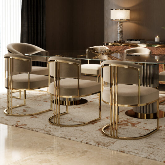 A modern dining room features Modern Art Deco Style Dining Chairs with gold metal frames, a glass-topped table, and a patterned rug on marble floors. Warm lighting and neutral tones enhance the elegant, luxurious ambiance.