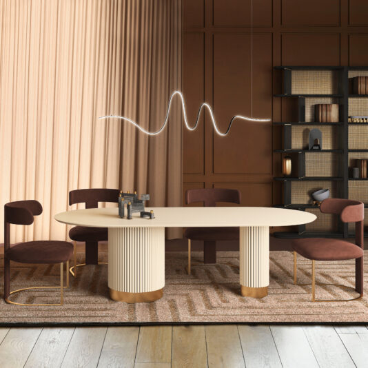 A modern dining room with an Oval Contemporary Lacquered Dining Table, four velvet chairs, a wavy pendant light, floor-to-ceiling curtains, brown paneled walls, a shelving unit with decor items, and a patterned rug.