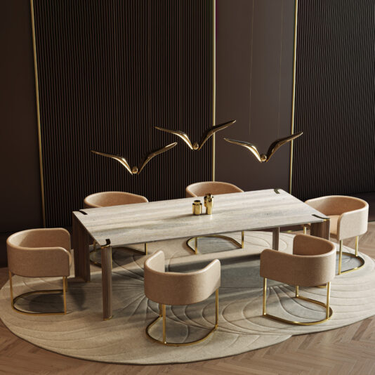 A modern dining room showcases a Contemporary Rectangular Stone Dining Table, six beige chairs with gold legs, a round beige rug, and three gold bird-shaped pendant lights above the table against a dark-panelled wall.