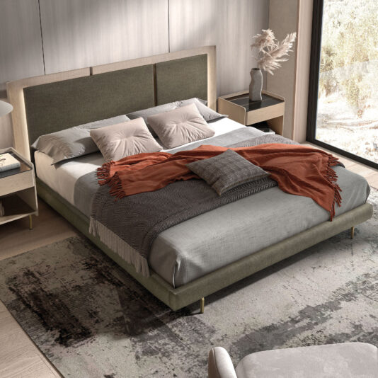 A modern bedroom featuring the Contemporary Bed With Backlit Headboard, green upholstered frame, grey bedding, pillows, and a rust throw blanket. Neutral walls, a patterned rug, and a large window enhance the bright space.